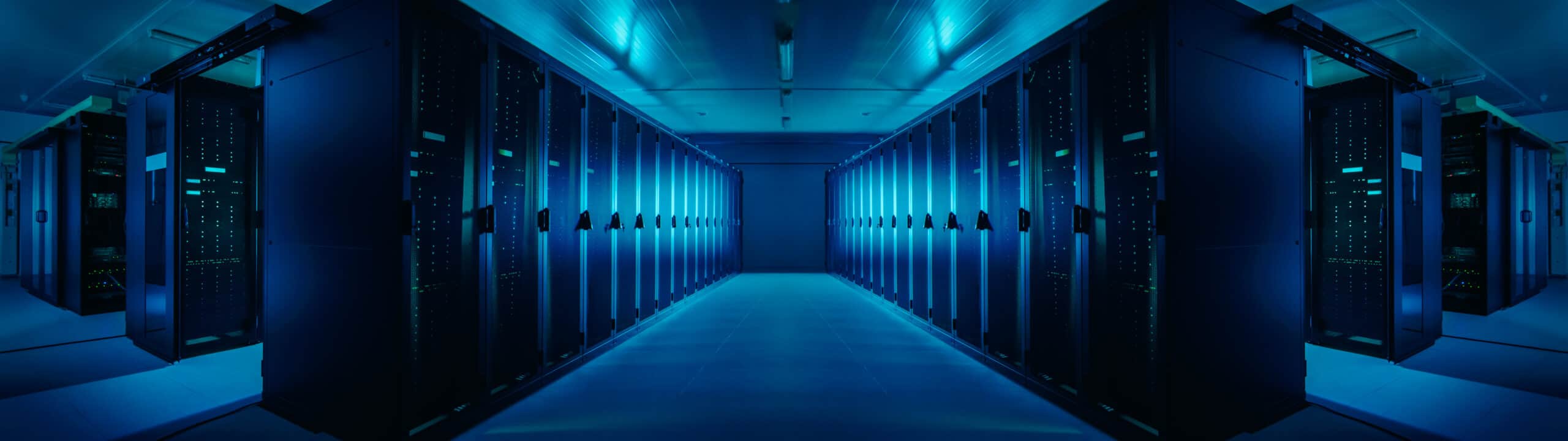 Wide-Angle Panorama Shot of a Working Data Center With Rows of Rack Servers. Blue Led Lights Blinking and Computers are Working. Dark Ambient Light.